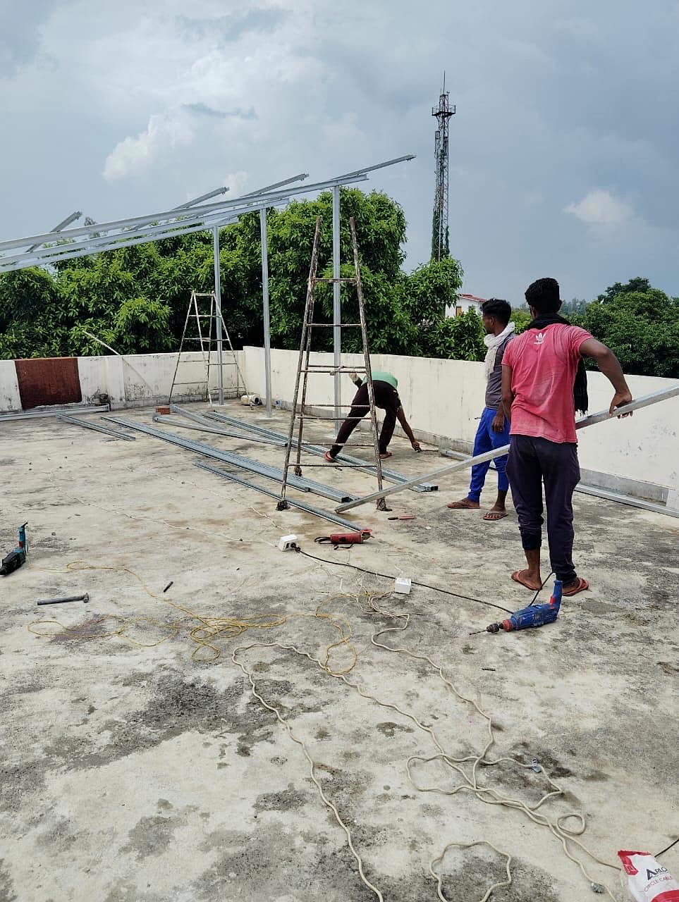 Gauri Enterprises installation crew working on-site with ladders and tools
