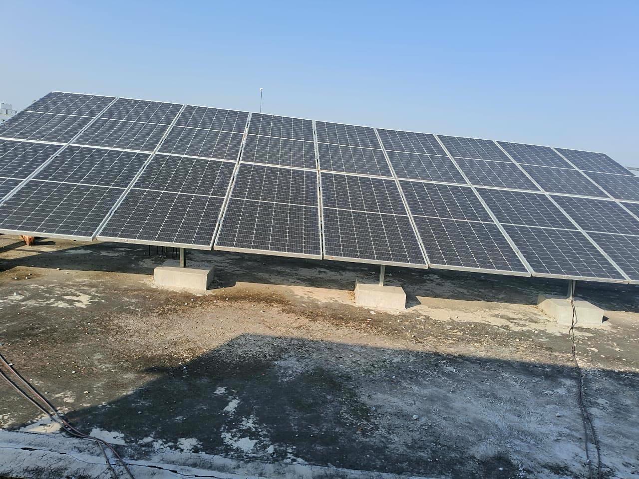 Close-up of finished solar panels installed under a clear blue sky